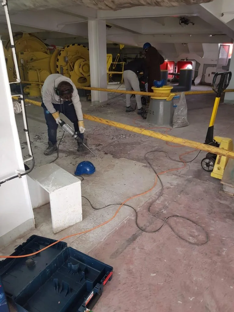 Removing the non-slip coating from a steel ship deck